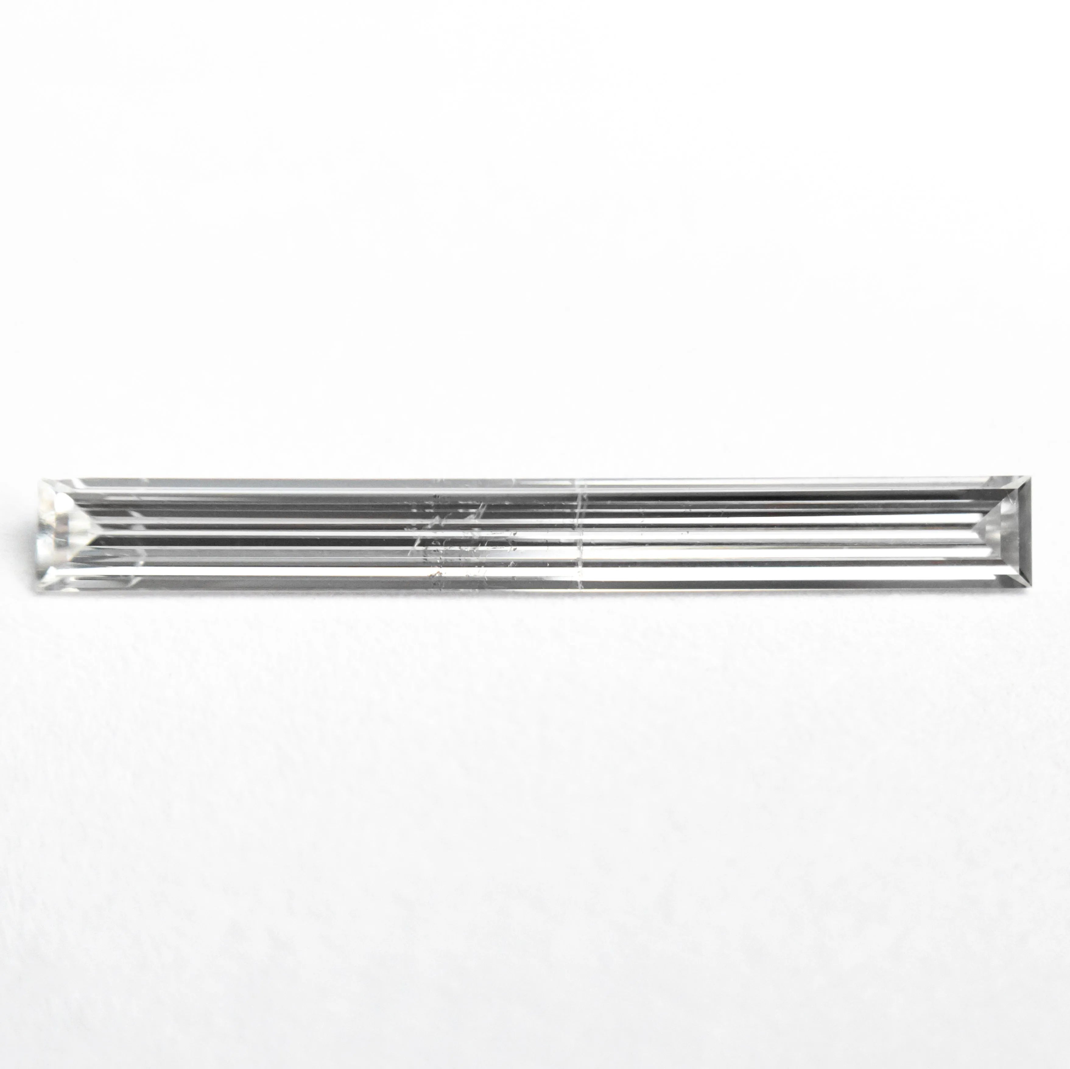 0.52ct 19.44x2.17x1.09mm SI2 E Baguette Step Cut 26545-01