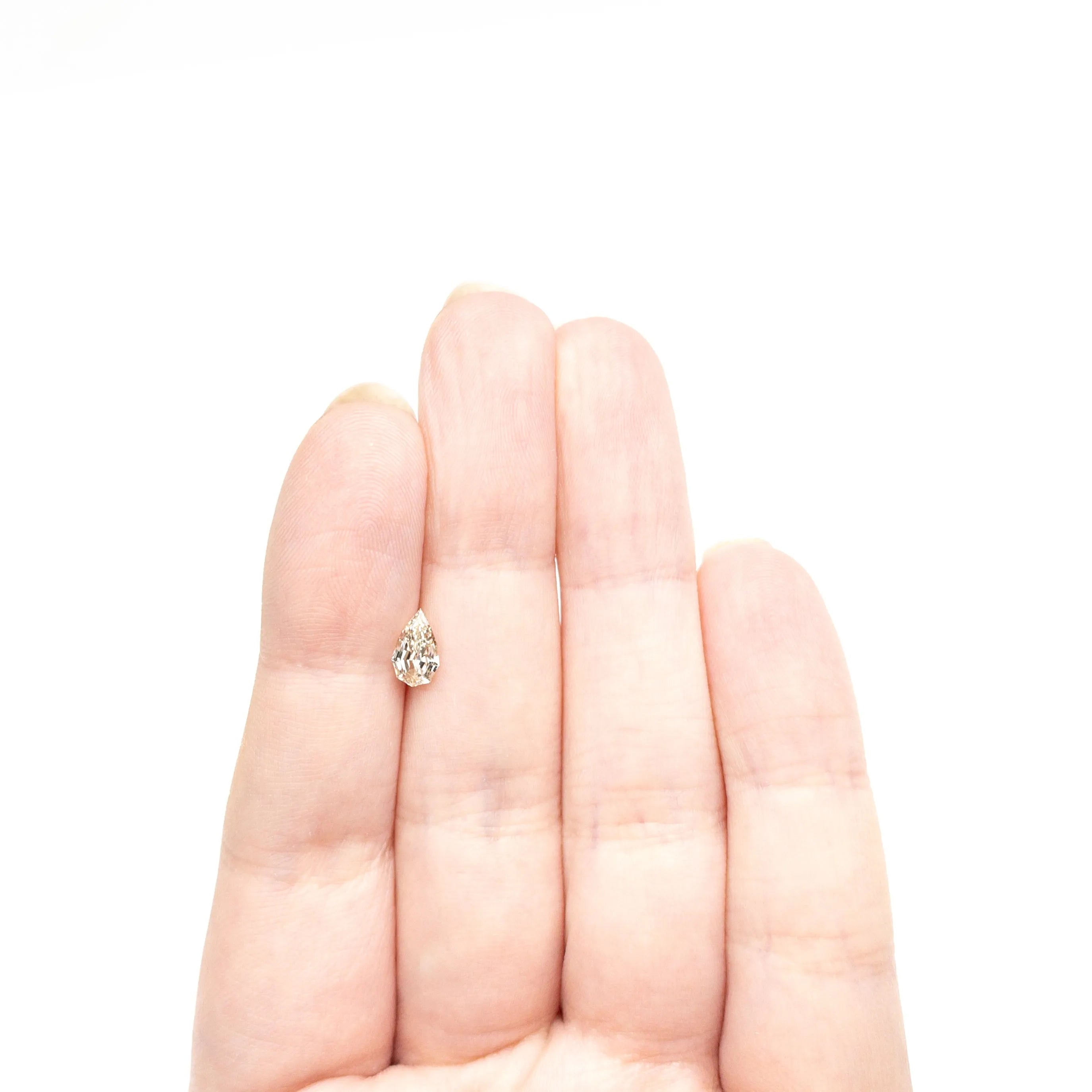 0.71ct 7.85x4.68x2.90mm VVS2 Q-R Geo Pear Step Cut 🇿🇦 27364-15