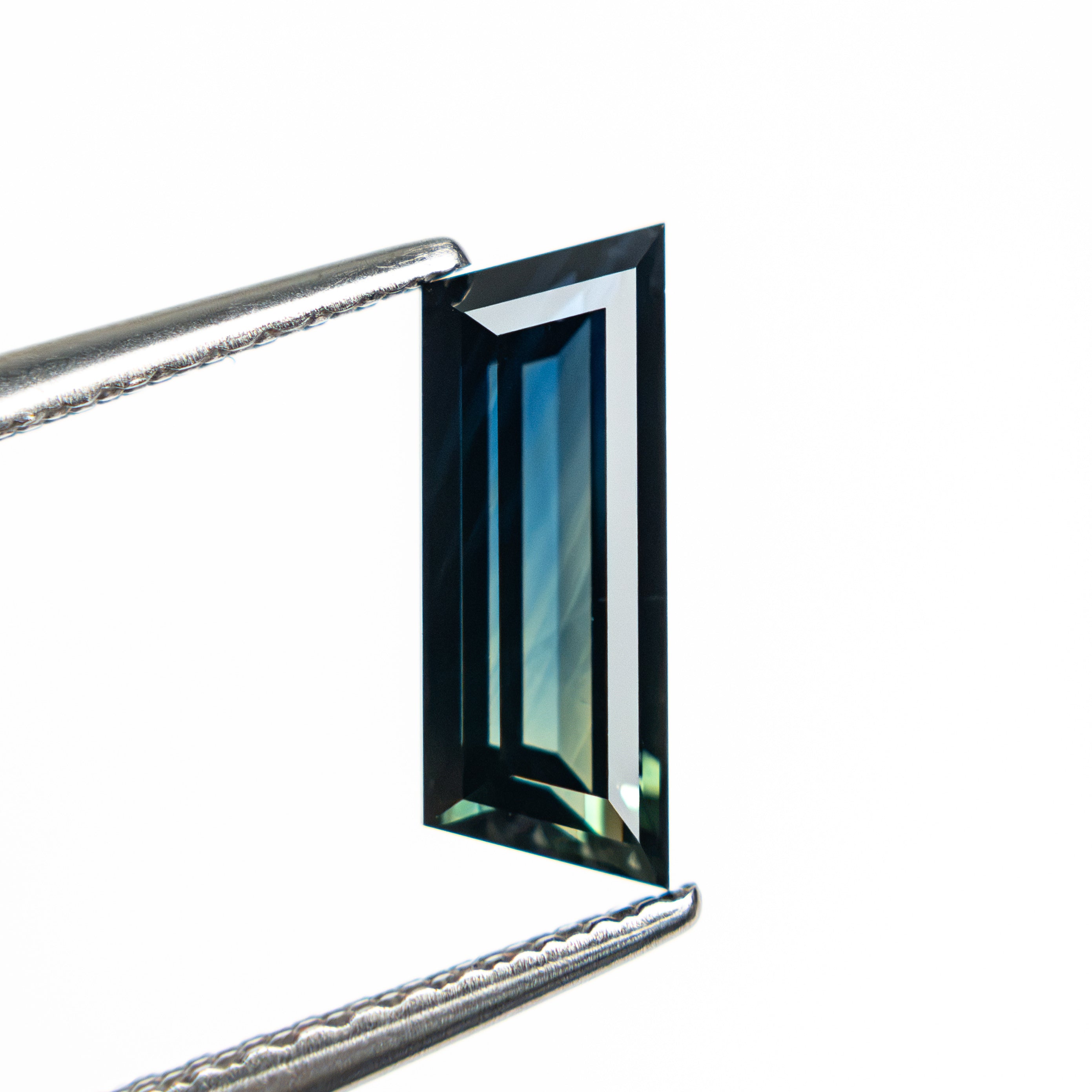 1.31ct 10.46x3.86x2.76mm Trapezoid Step Cut Sapphire 27766-11