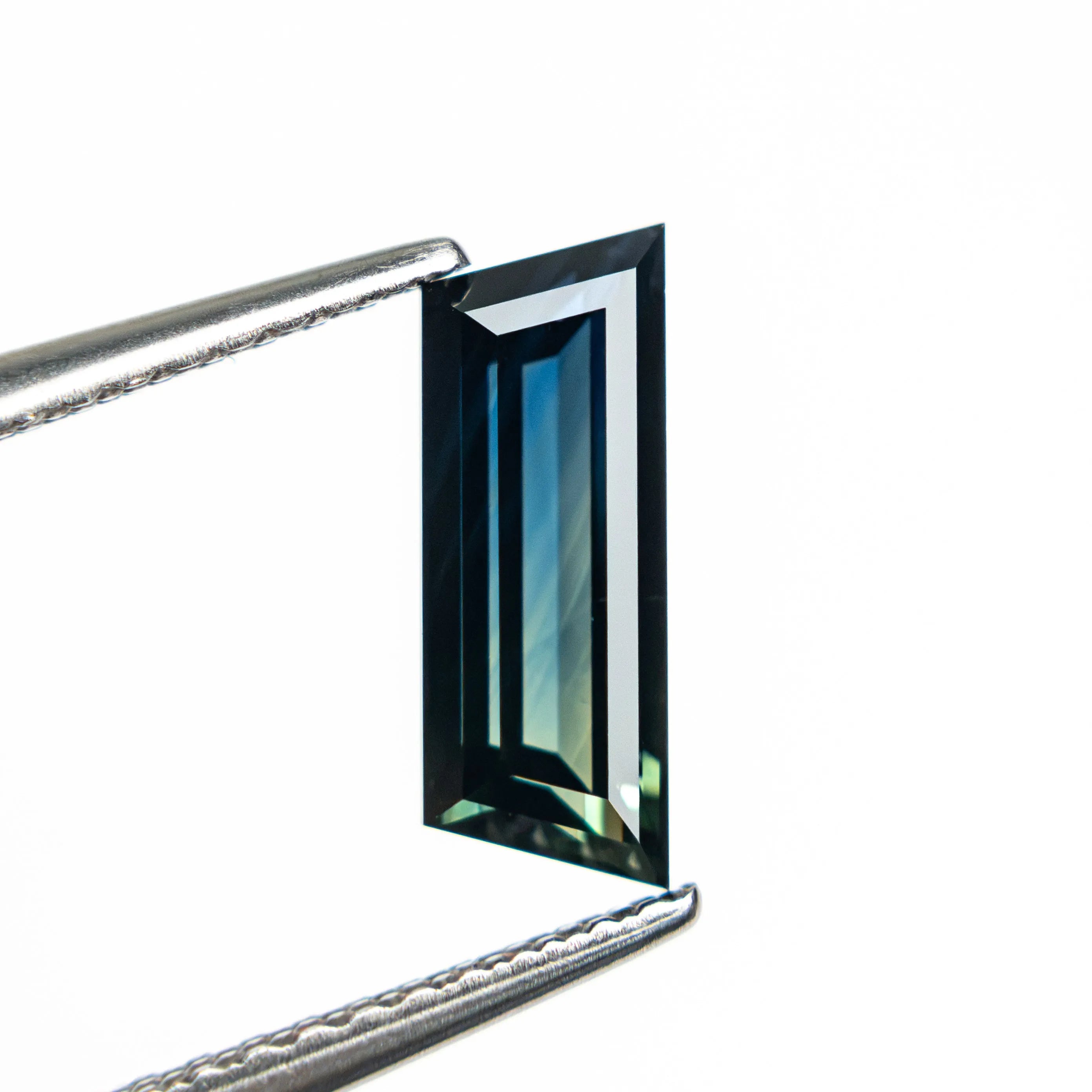 1.31ct 10.46x3.86x2.76mm Trapezoid Step Cut Sapphire 27766-11