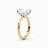 Abby | Emerald Solitaire Tapered Band Engagement Ring