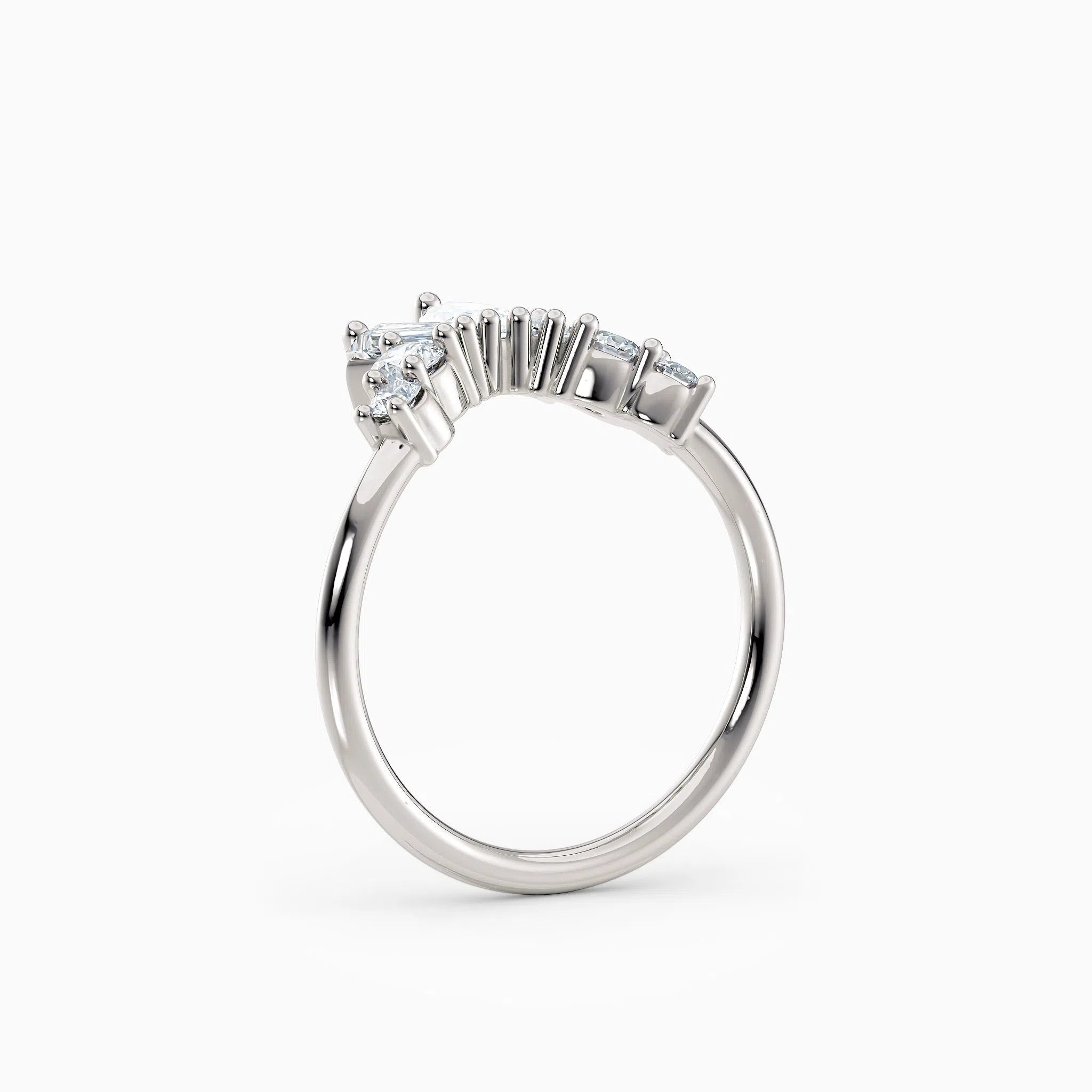 Contoured diamond wedding band featuring pear, round, and baguette diamonds.