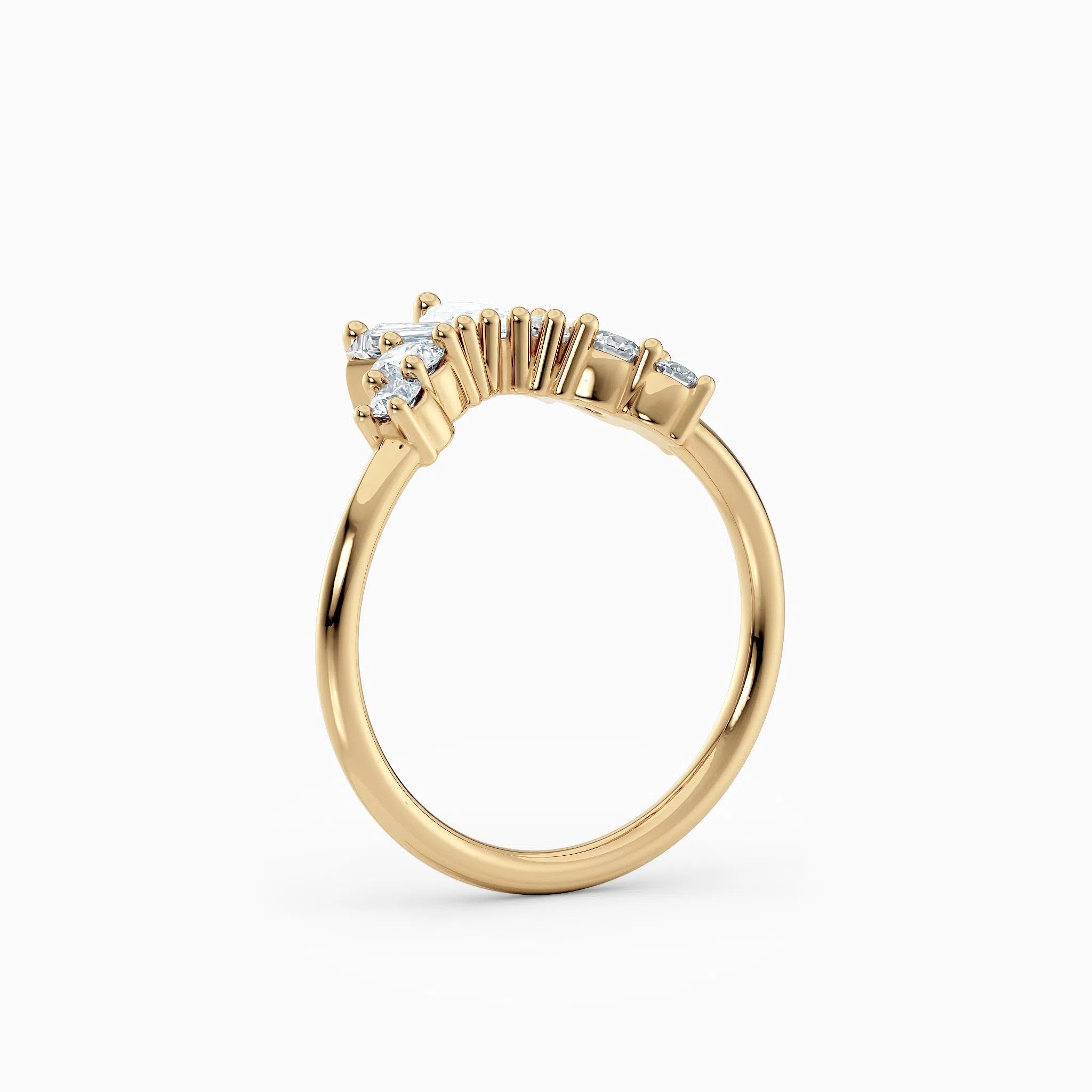 Contoured diamond wedding band featuring pear, round, and baguette diamonds.