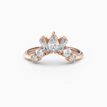 Contoured diamond wedding band featuring pear, round, and baguette diamonds.