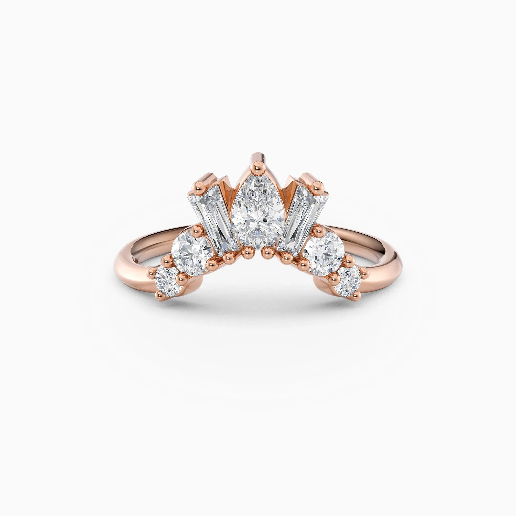 Contoured diamond wedding band featuring pear, round, and baguette diamonds.