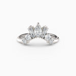 Contoured diamond wedding band featuring pear, round, and baguette diamonds.